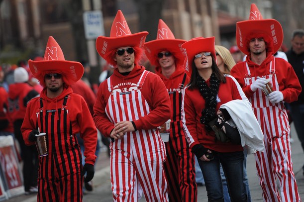 Nebraska fans show their team pride with stripes and cowboy hats as they walk outside Memorial Stadium in Lincoln, Nebraska on Saturday. Melanie Maxwell I AnnArbor.com